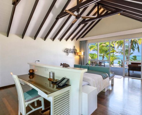 KUR_Deluxe_Beach_Villa_2025_01 Ocean views from the deluxe beach villa bedroom at Kuredu island resort & spa in The Maldives