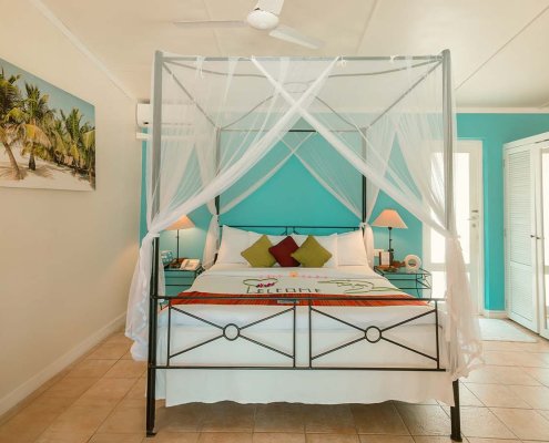 KUR_GardenBungalow_2025_4 Kuredu in The Maldives garden beach villa bedroom with four poster bed